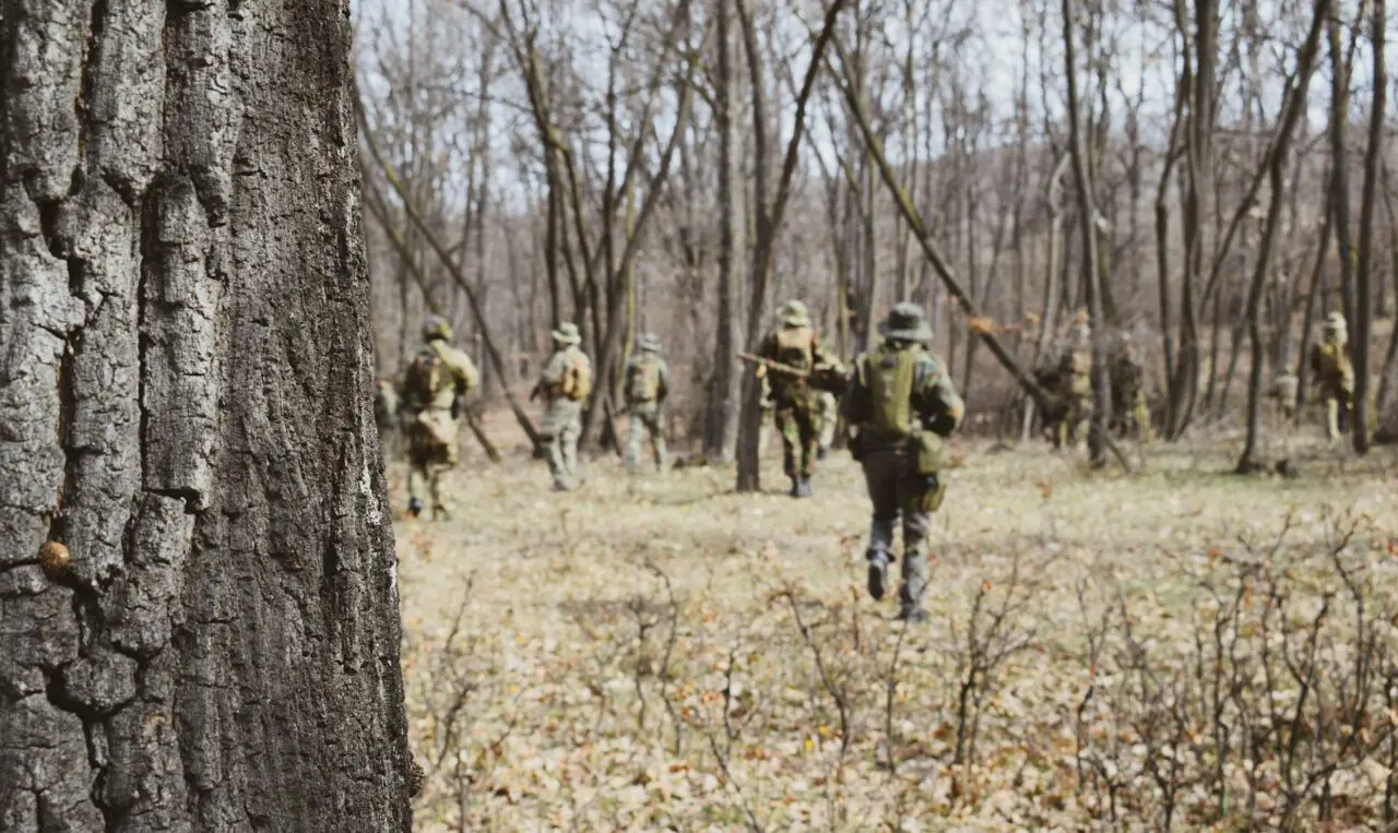 A group of airsofters in a woodland